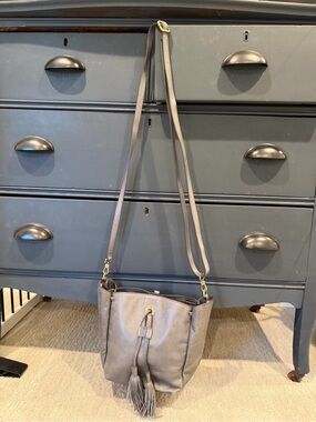 Elegant HOBO Gray Leather Crossbody Bucket Bag with Tassel